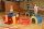 Kinder spielen auf bunten, weichen Kletterelementen in einer Sporthalle