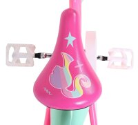 Pinkes Fahrrad mit buntem Sattel und grafischem Design