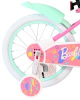 Buntes Kinderfahrrad mit pinkem Rahmen und weißen...