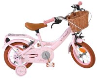 Rosa Kinderfahrrad mit Korb und braunen Details