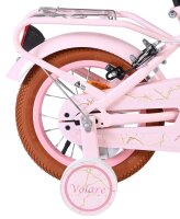 Rosa Kinderfahrrad mit braunem Reifen und...