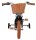 Schwarzes Kinderfahrrad mit Korb und orangefarbenen Pedalen