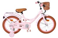 Rosa Kinderfahrrad mit Korb und braunen Reifen