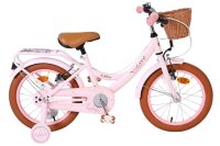 Rosa Kinderfahrrad mit Korb und braunen Reifen