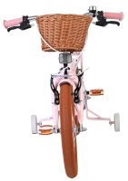 Rosa Kinderfahrrad mit Korb und orangefarbenen Reifen