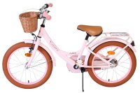 Rosa Kinderfahrrad mit Korb, braunen Reifen und beigem Sattel