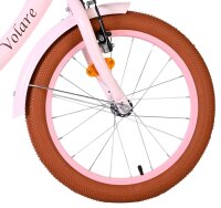 Vorderreifen eines Fahrrads mit braunem Profil und pinker Felge