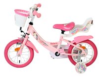 Rosa Kinderfahrrad mit Einhornmotiv und Korb vorne