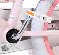 Rosa Fahrrad mit weißem Pedal und Aufkleber am Rahmen