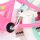 Rosa Kinderfahrrad mit chromfarbener Pedale und weißen Reifen