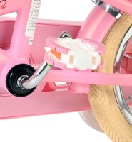 Rosa Fahrradpedal mit weißem Reflektor und beigem Reifen