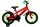 Rotes Kinderfahrrad mit grünen Akzenten und Stützrädern