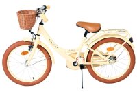 Kinderfahrrad mit Korb, braunen Reifen und beigem Rahmen