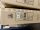 Braune Kartonverpackung mit Produktinformationen und Barcode sichtbar