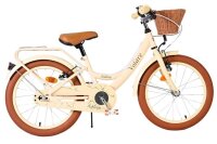 Beige Kinderfahrrad mit Korb, braunen Reifen und...