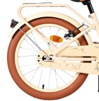 Helles Fahrrad mit braunem Reifen und...
