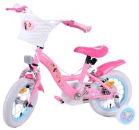 Rosa Kinderfahrrad mit Korb, weißen Reifen und bunten Aufklebern