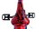 Rotes Fahrrad-Sattel mit schwarzem Comic-Muster und Pedalen im Hintergrund