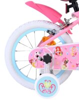 Rosa Kinderfahrrad mit bunten Aufklebern und weißen...
