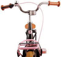Fahrradlenker mit pinkem Kabel und braunen Griffen,...