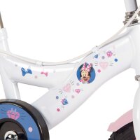 Weißes Kinderfahrrad mit bunten Aufklebern und Minnie-Maus-Motiv