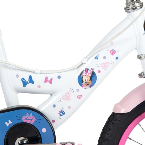 Weißes Kinderfahrrad mit bunten Aufklebern und Minnie-Maus-Motiv