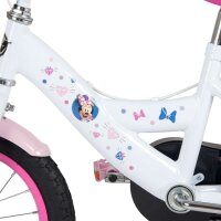 Weißes Kinderfahrrad mit bunten Aufklebern und Minnie-Maus-Motiv